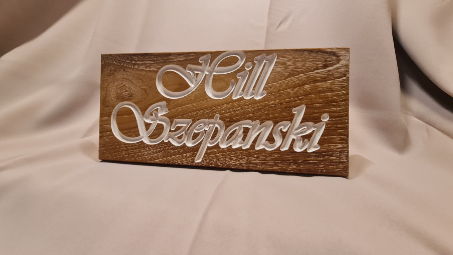 Namn skylt med gravyr och epoxy inlay